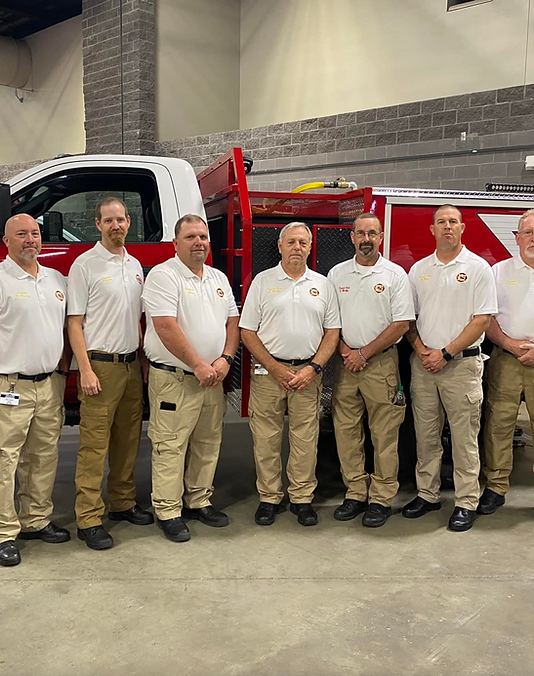 David's Fire Equipment employees standing in front of pickup truck